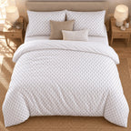 White Grey Triangle Arrow duvet cover set, overhead view showing the full bed on a jute rug between oak bedside tables