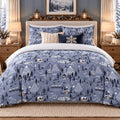 Winter Village Christmas duvet cover set, front view showing blue village print with snowflake cushion