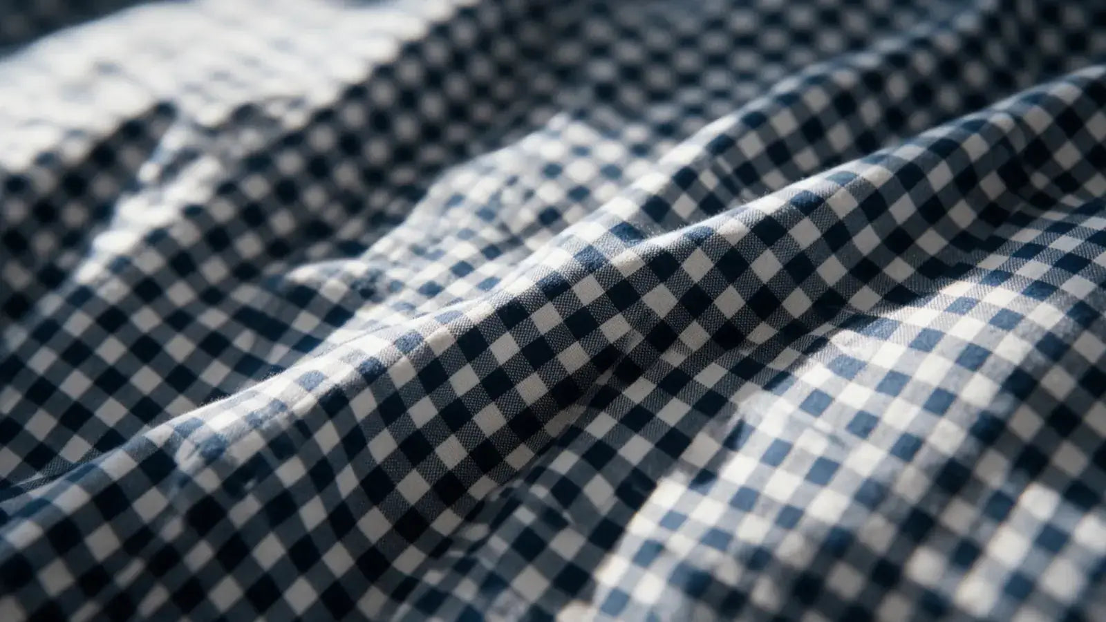 Close-up of a navy gingham brushed microfibre duvet cover